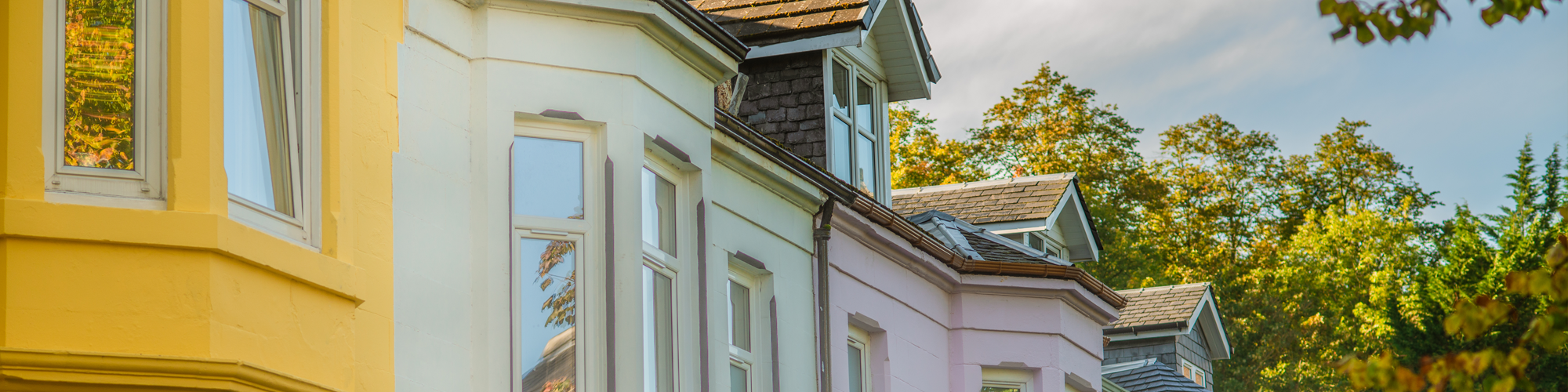 Can I remortgage early? A guide from SAM  Conveyancing. A sunny Victorian terrace with bay and dormer windows 