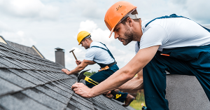 What are leasehold service charges? Explained by SAM conveyancing. Two workers in hard hats and overalls nail tiles to a roof What are leasehold service charges? Explained by SAM conveyancing. Two workers in hard hats and overalls nail tiles to a roof