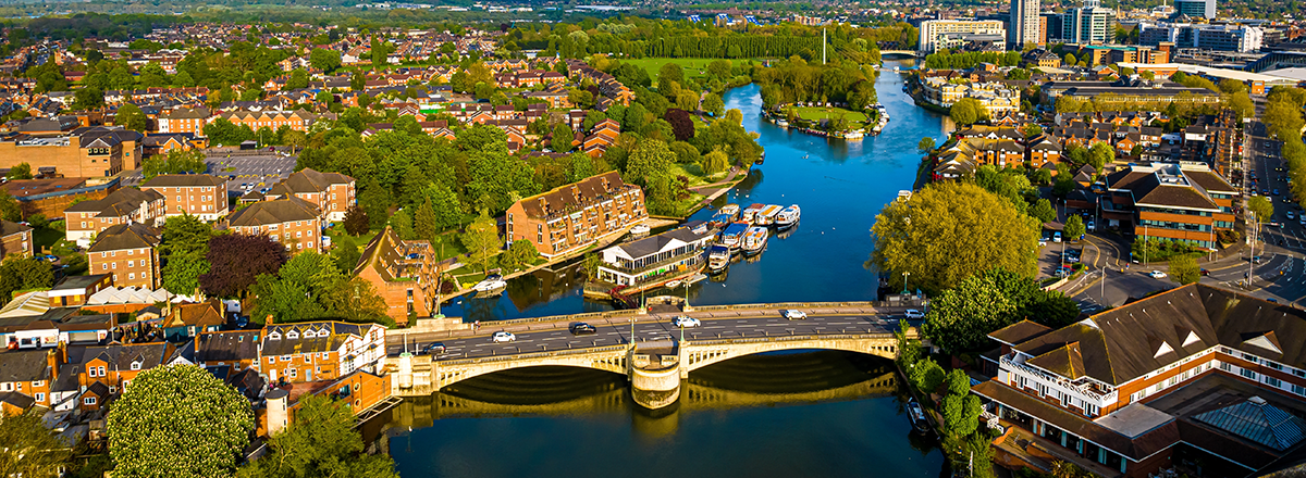 Aerial view of homes on the river in Reading in Berkshire, in the South East of England. SAM Conveyancing's analysis of the Berkshire property market