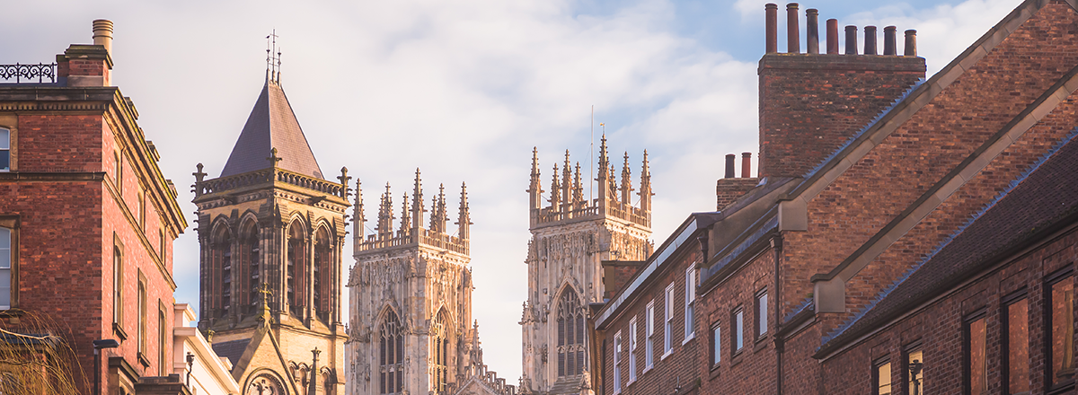 Morning golden light on the historic old town of York along Museum St. looking towards York Minster Cathedral in North Yorkshire, England, UK. SAM Conveyancing analyse the latest Land Registry Data for your North Yorkshire housing market report